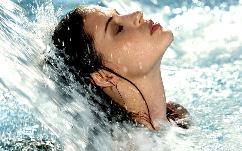 woman enjoying water spray
