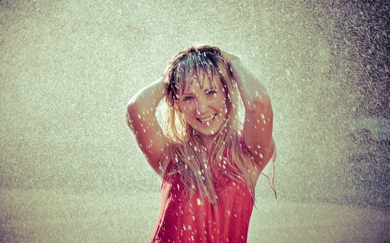woman enjoying water spray