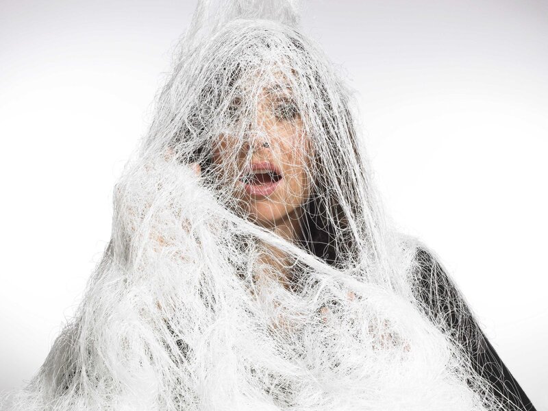 woman entangled in white fibers