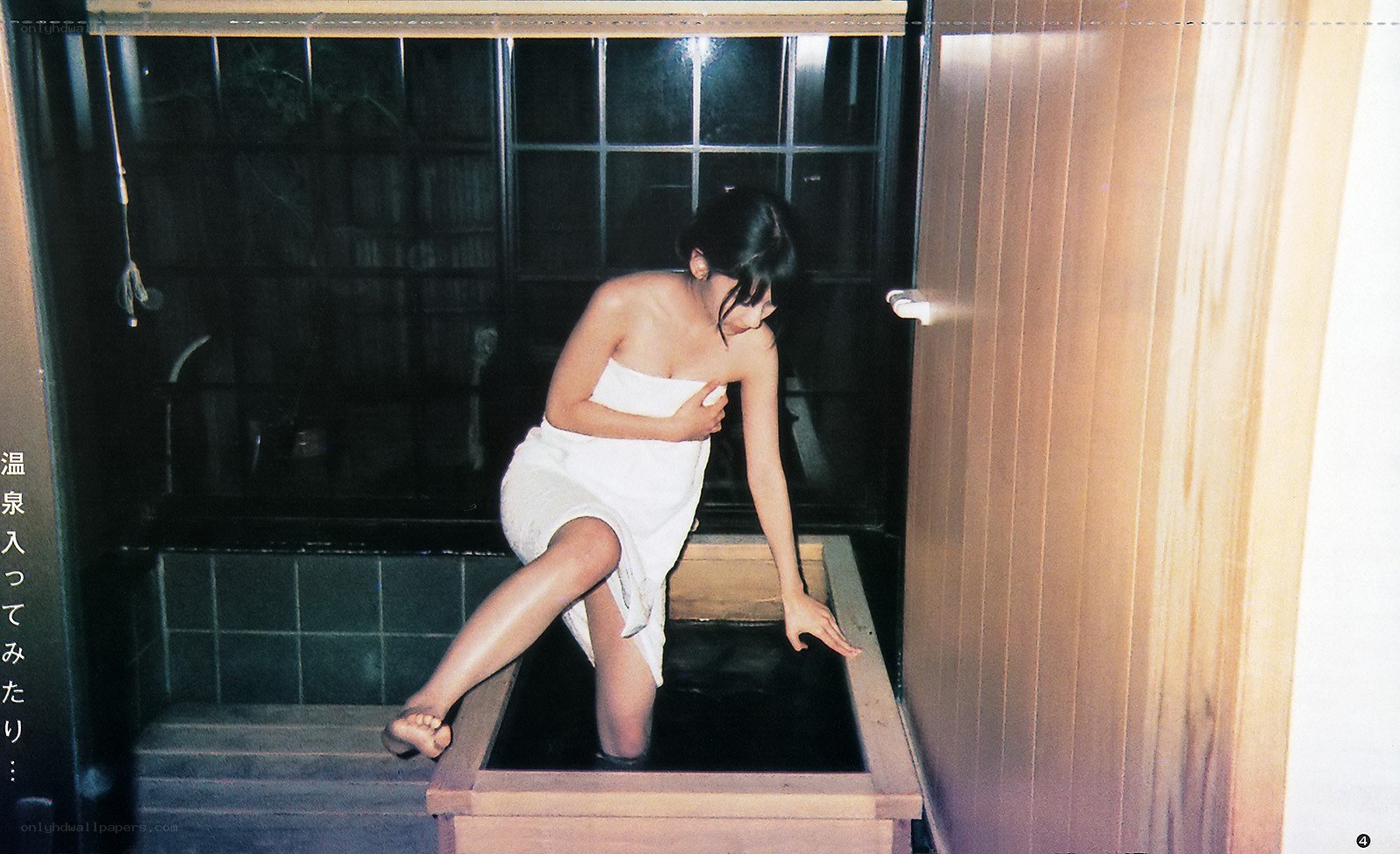 woman entering a hot spring