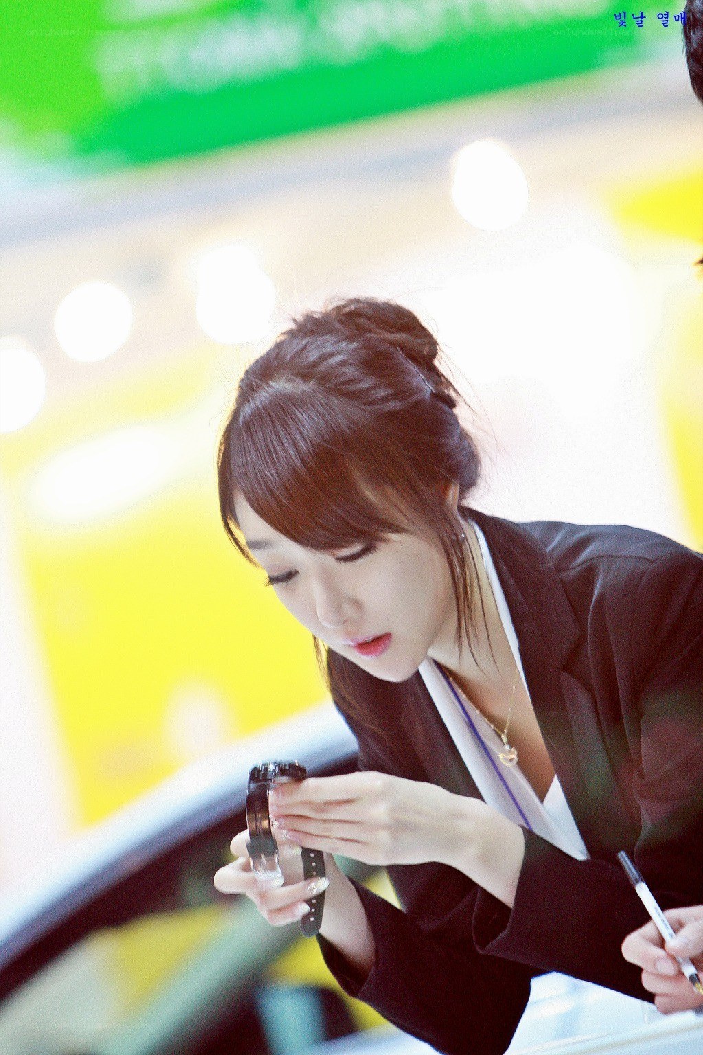 woman examining a watch
