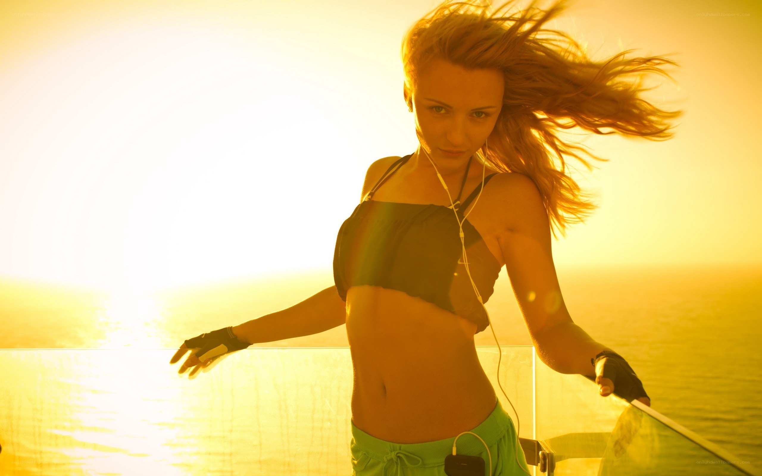 woman exercising at sunset