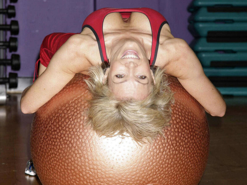 woman exercising on stability ball