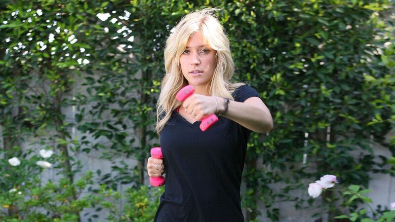 woman exercising with dumbbells