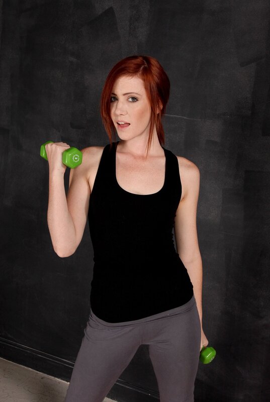 Woman exercising with dumbbells