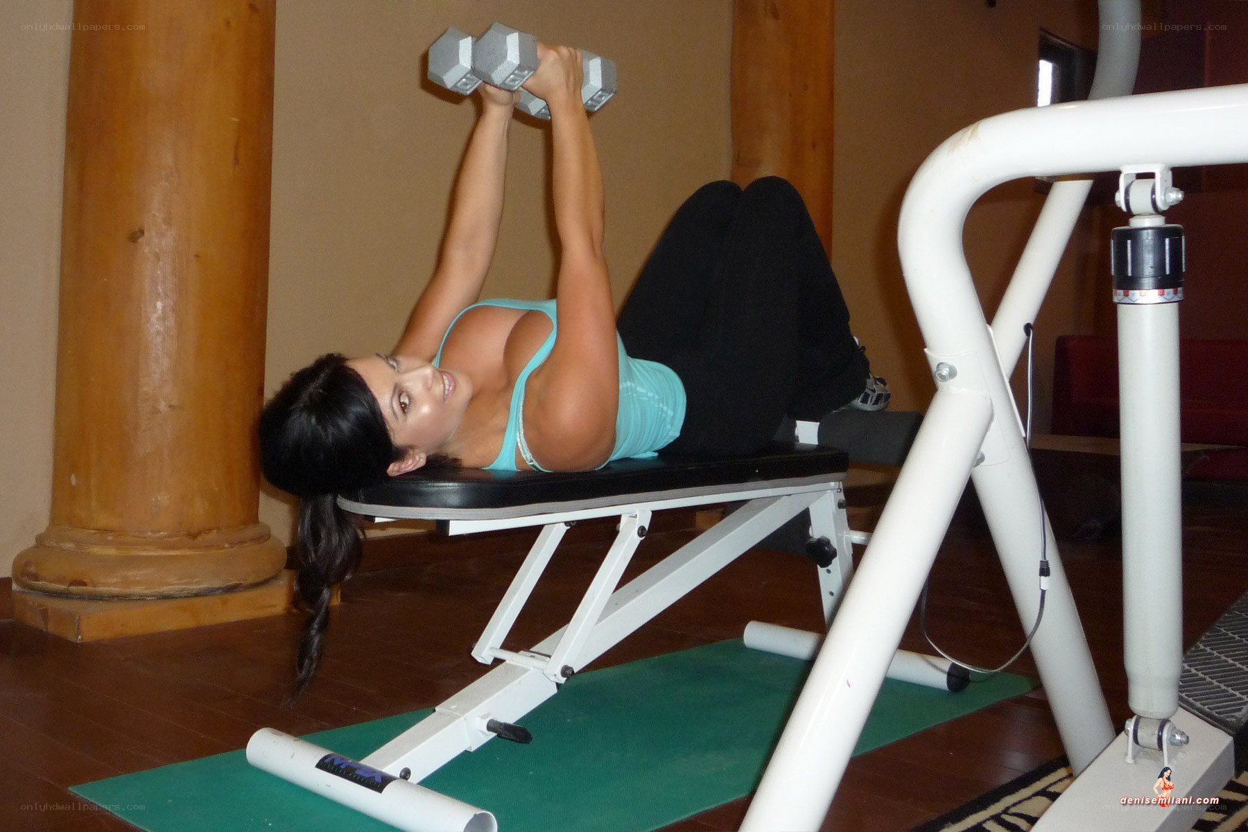 woman exercising with dumbbells