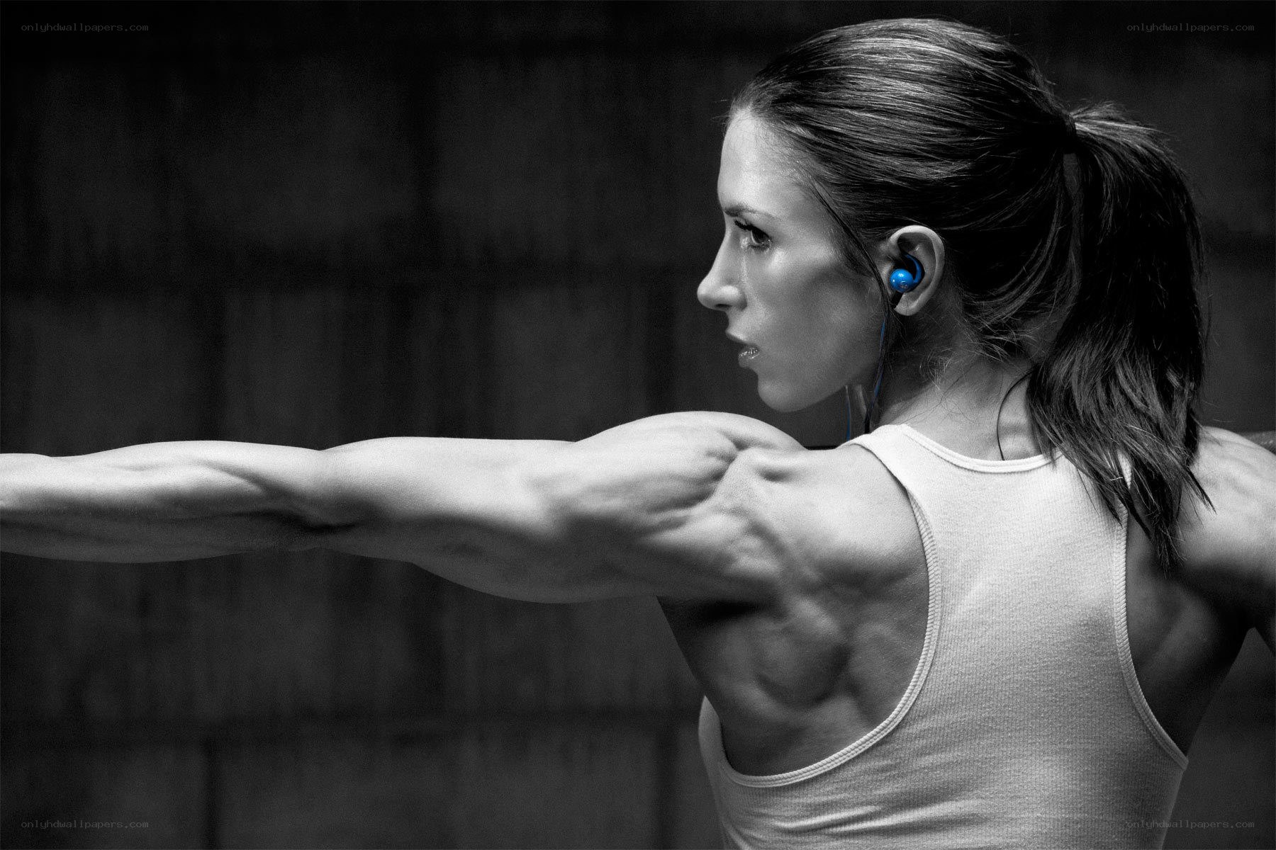 woman exercising with earbuds