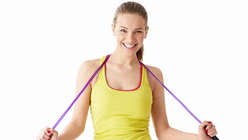 woman exercising with resistance band