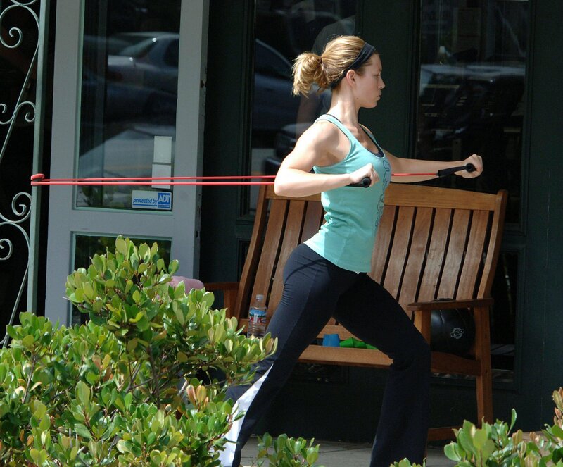 Woman exercising with resistance band