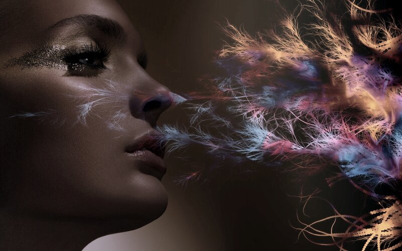 Woman Exhaling Colorful Particles