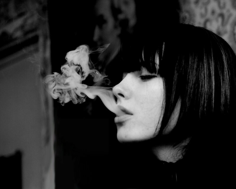 woman exhaling smoke
