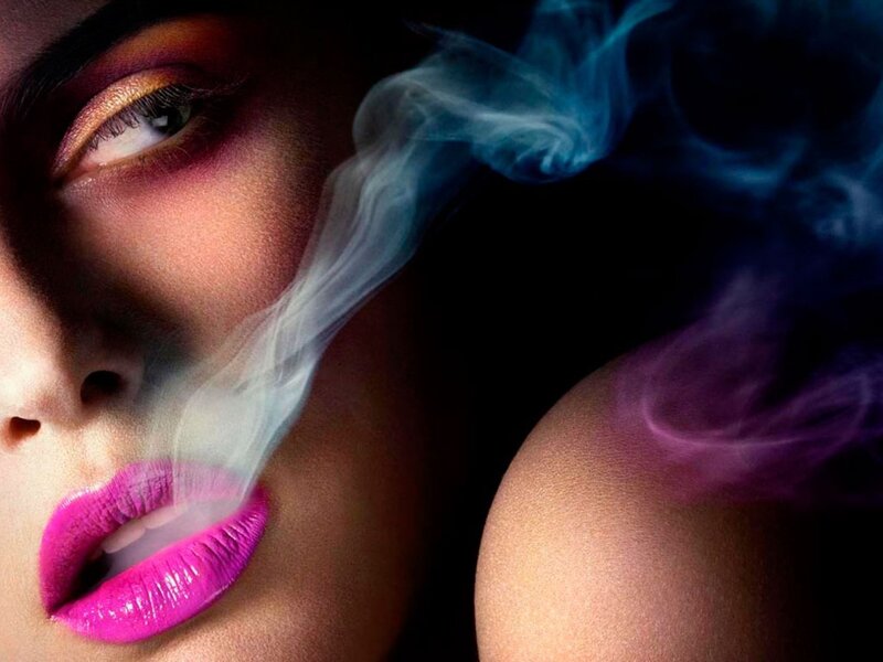woman exhaling smoke