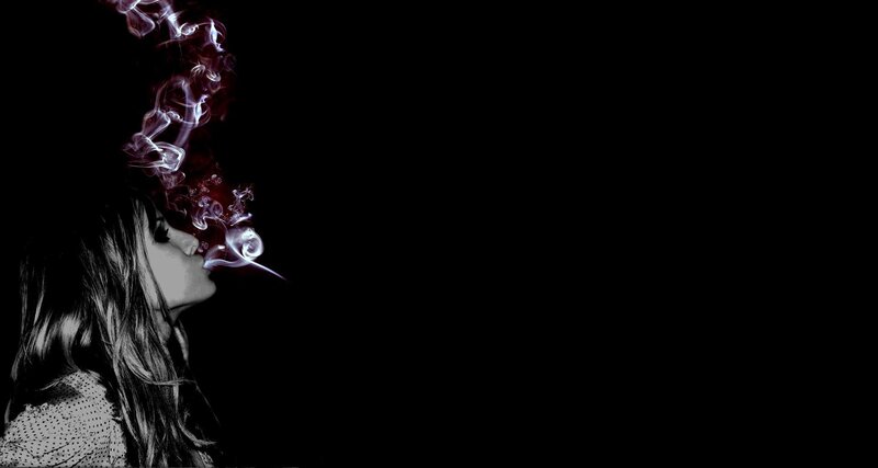 woman exhaling smoke