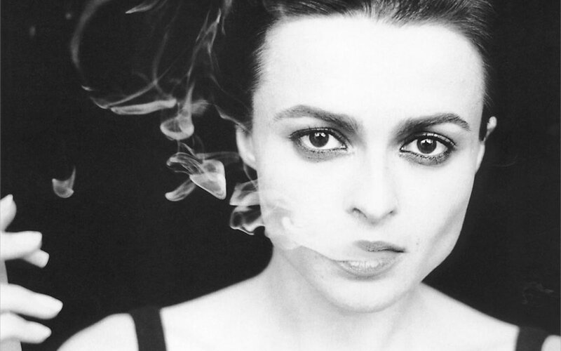 woman exhaling smoke