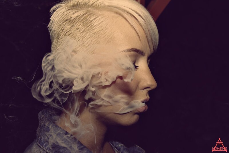 woman exhaling smoke