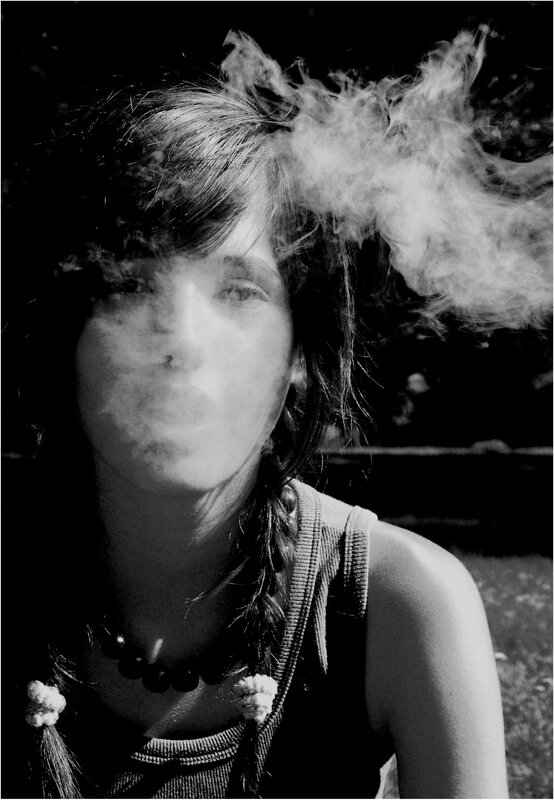woman exhaling smoke