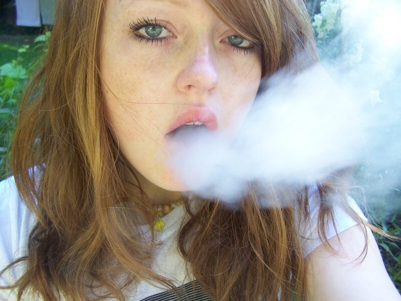 woman exhaling vapor