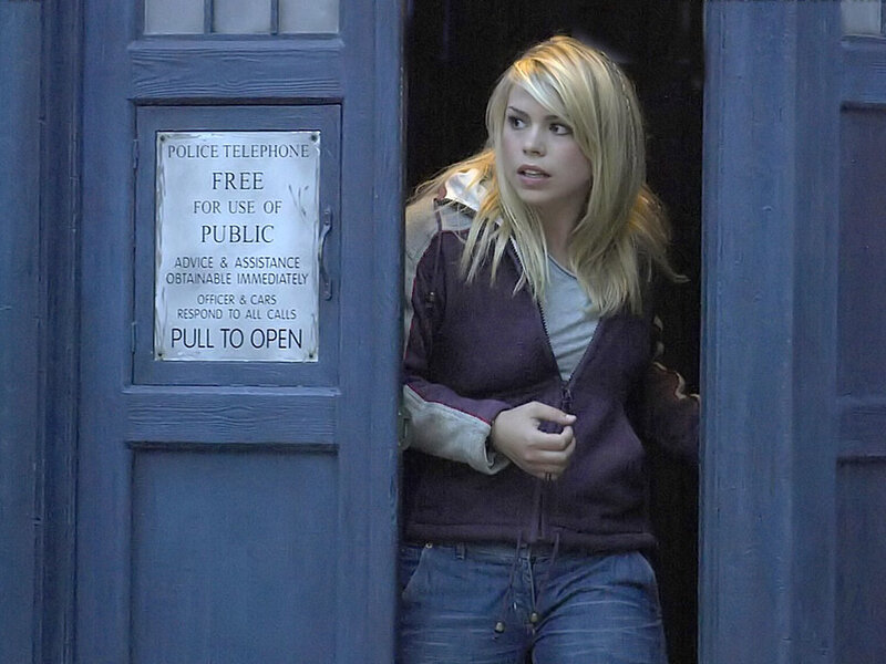 Woman exiting blue police box