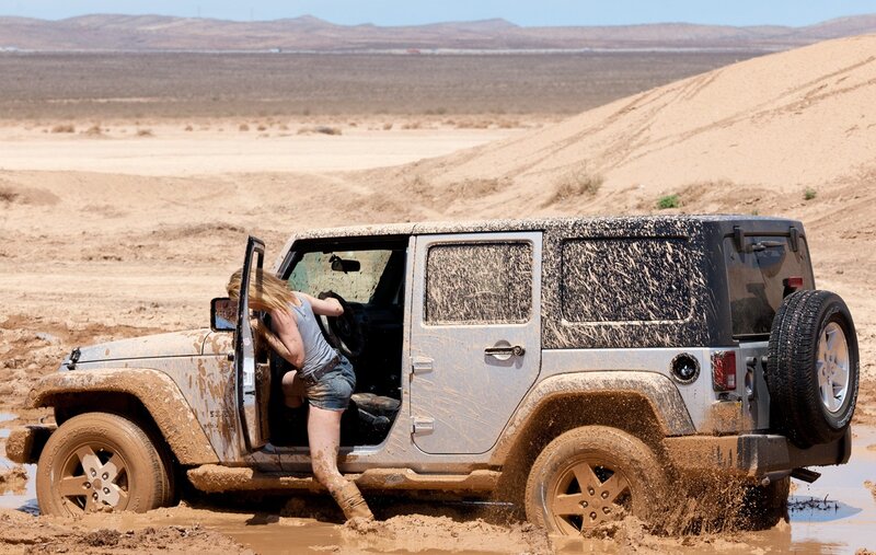 Woman Exiting Jeep — Brown, Dramatic, Afternoon