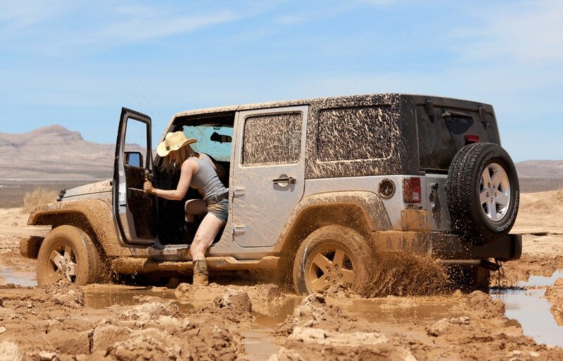 Woman Exiting Jeep — Brown, Dramatic