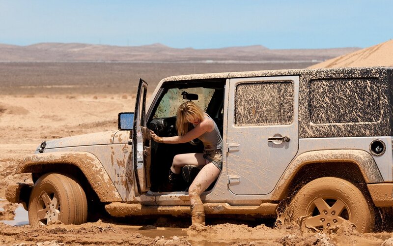 Woman Exiting Jeep — Brown