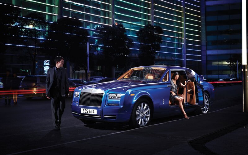 Woman Exiting Luxury Car — Blue, Dramatic