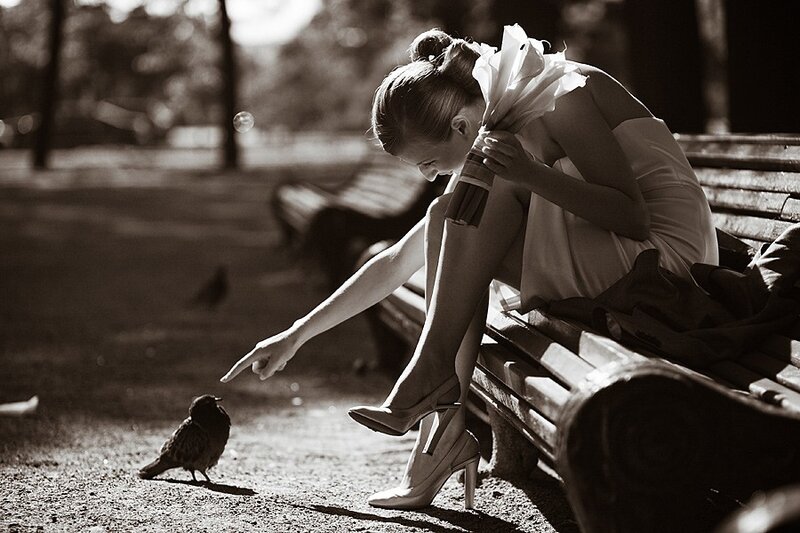 woman feeding a bird