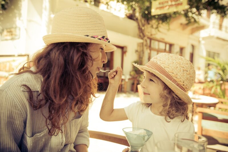 Woman Feeding Child Ice Cream