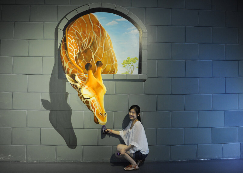 Woman Feeding Giraffe Mural