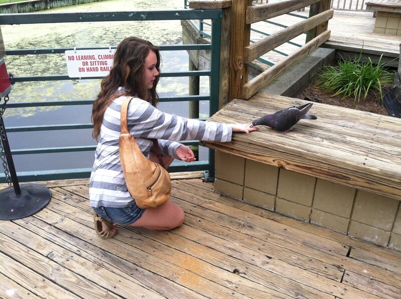 Woman Feeding Pigeon