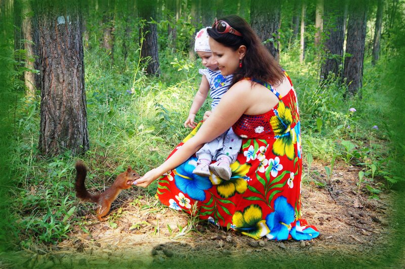 Woman Feeding Squirrel — Red