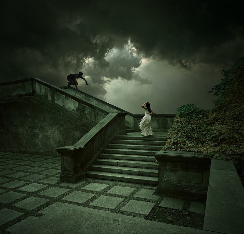 Woman fleeing on stone stairs