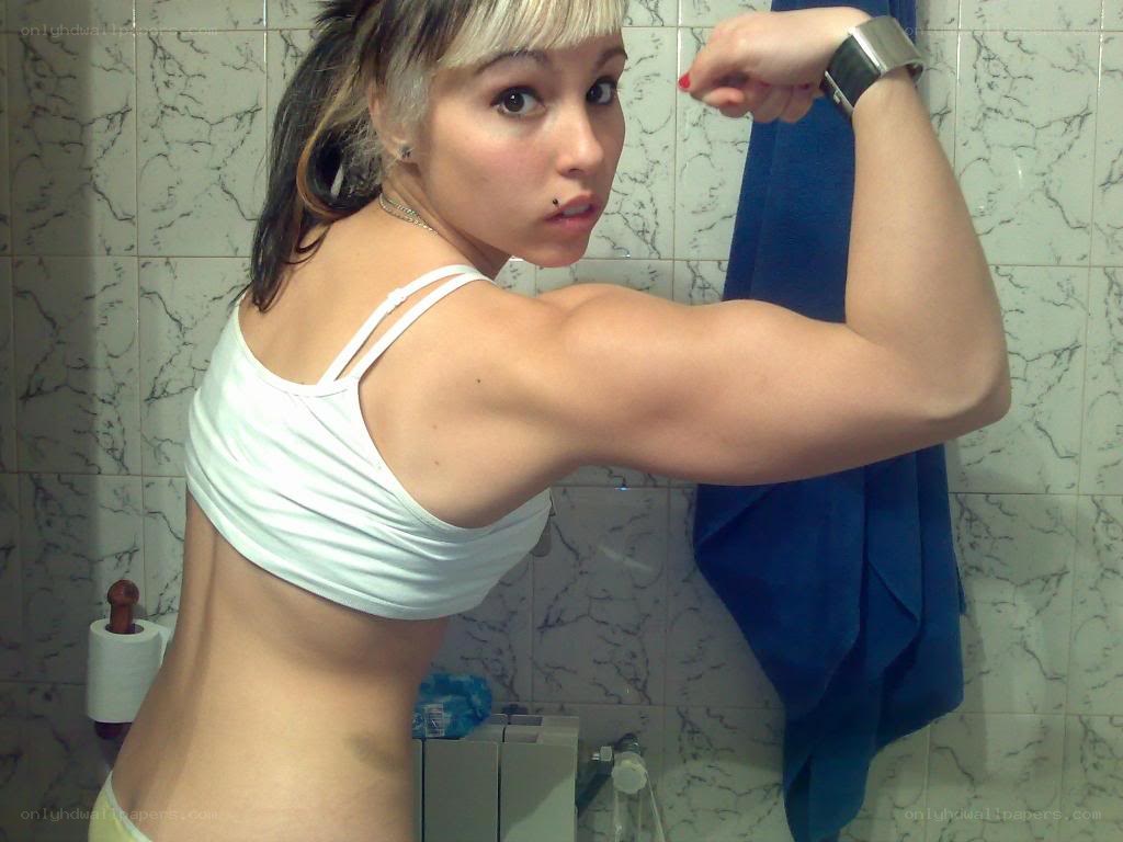 woman flexing in bathroom
