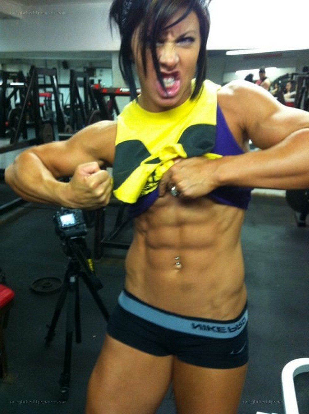 woman flexing in gym