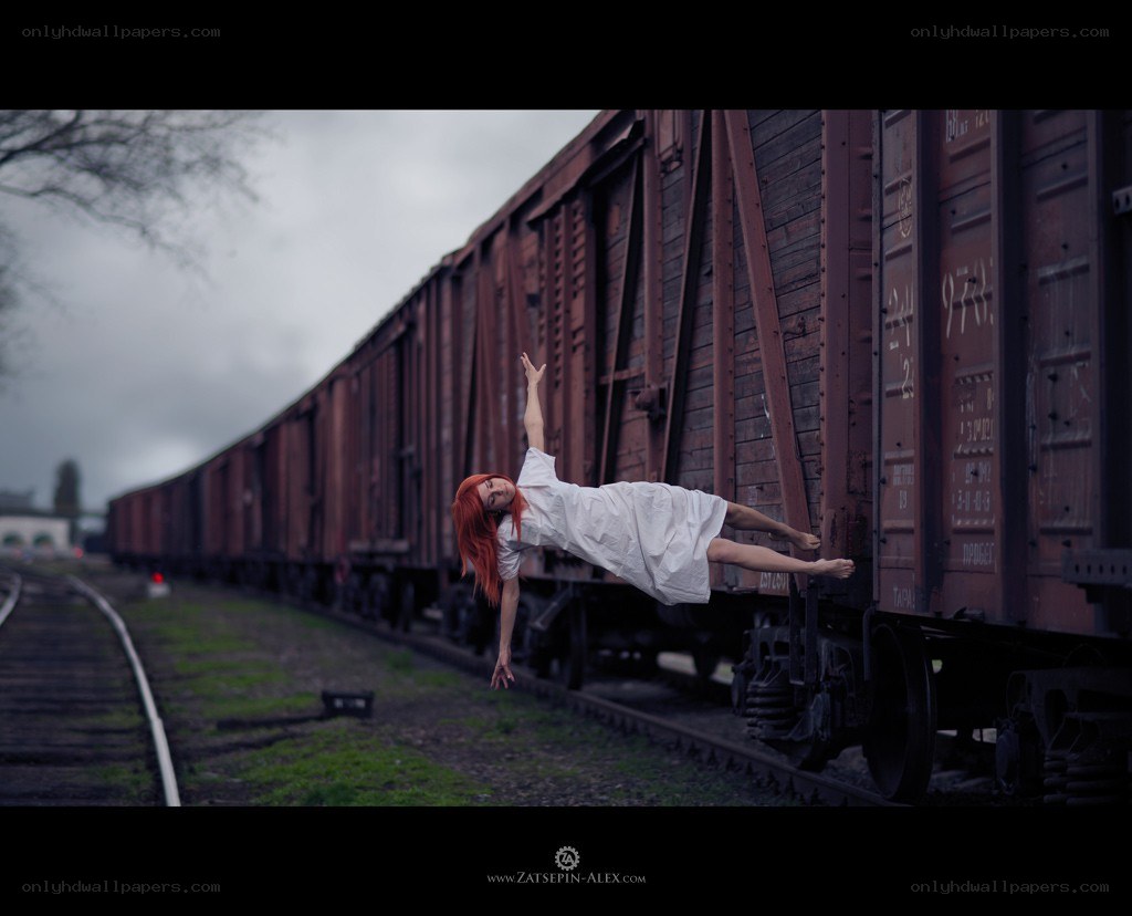 Woman floating beside train