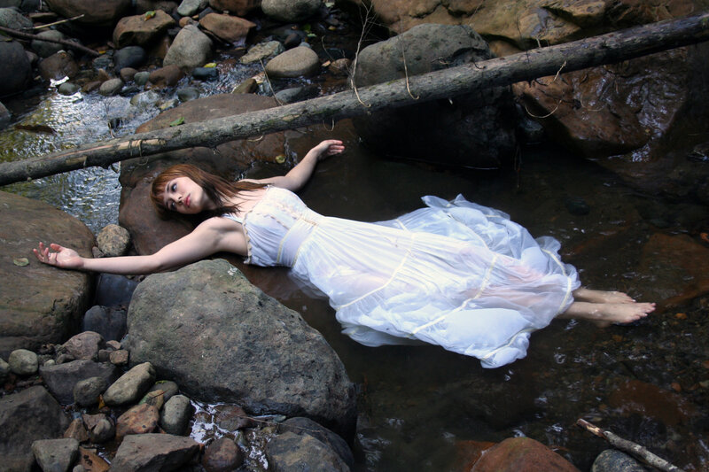 Woman floating in a stream