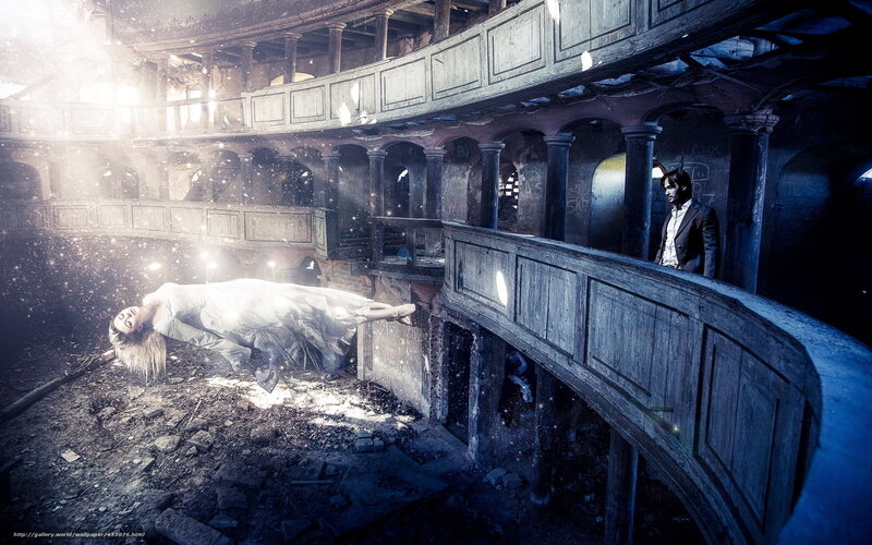 woman floating in abandoned theater