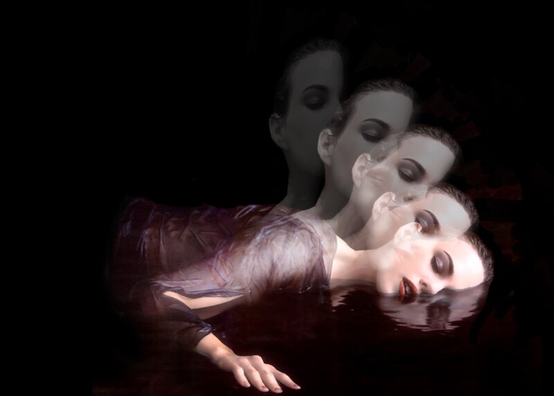 woman floating in dark water