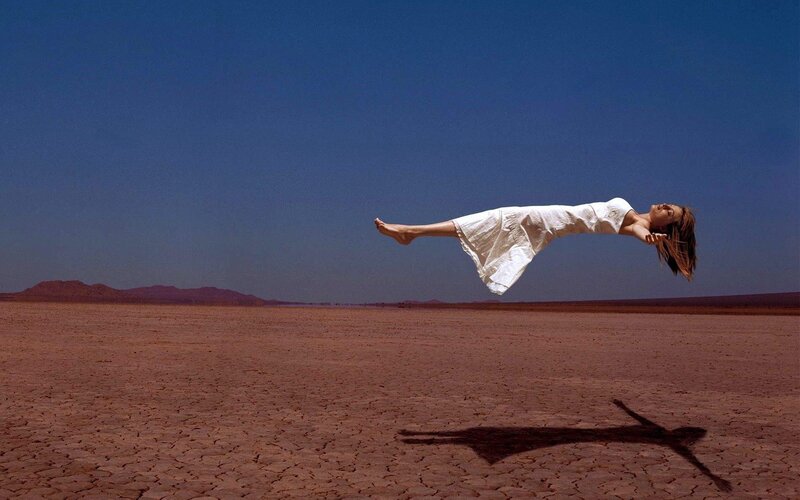 Woman Floating in Desert — Blue, Dramatic