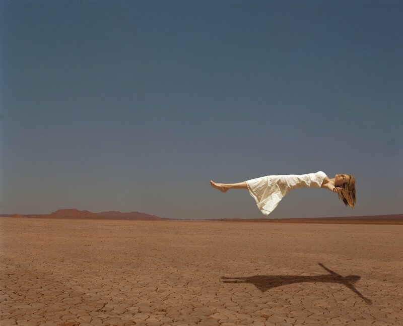 Woman Floating in Desert — Brown