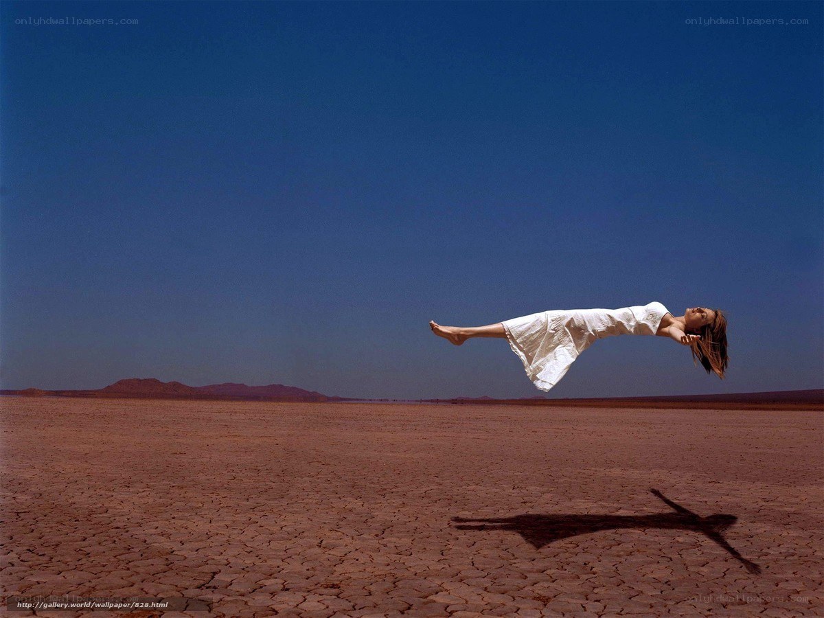 woman floating in desert