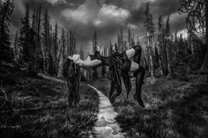 Woman Floating in Forest — Black