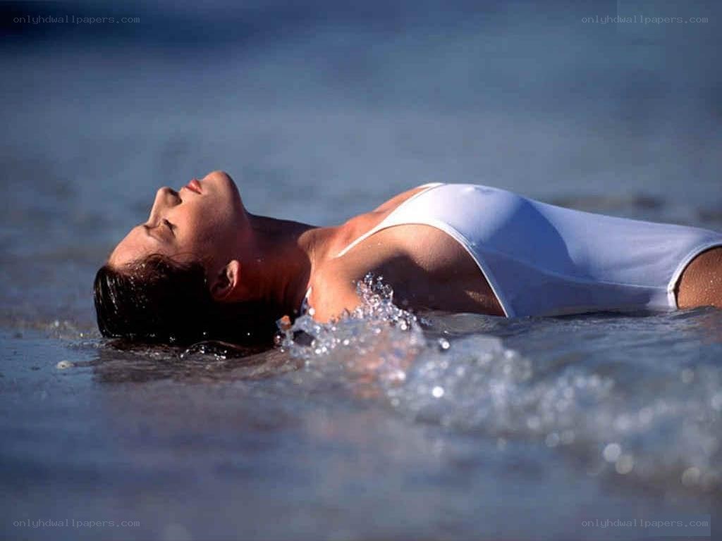 woman floating in ocean