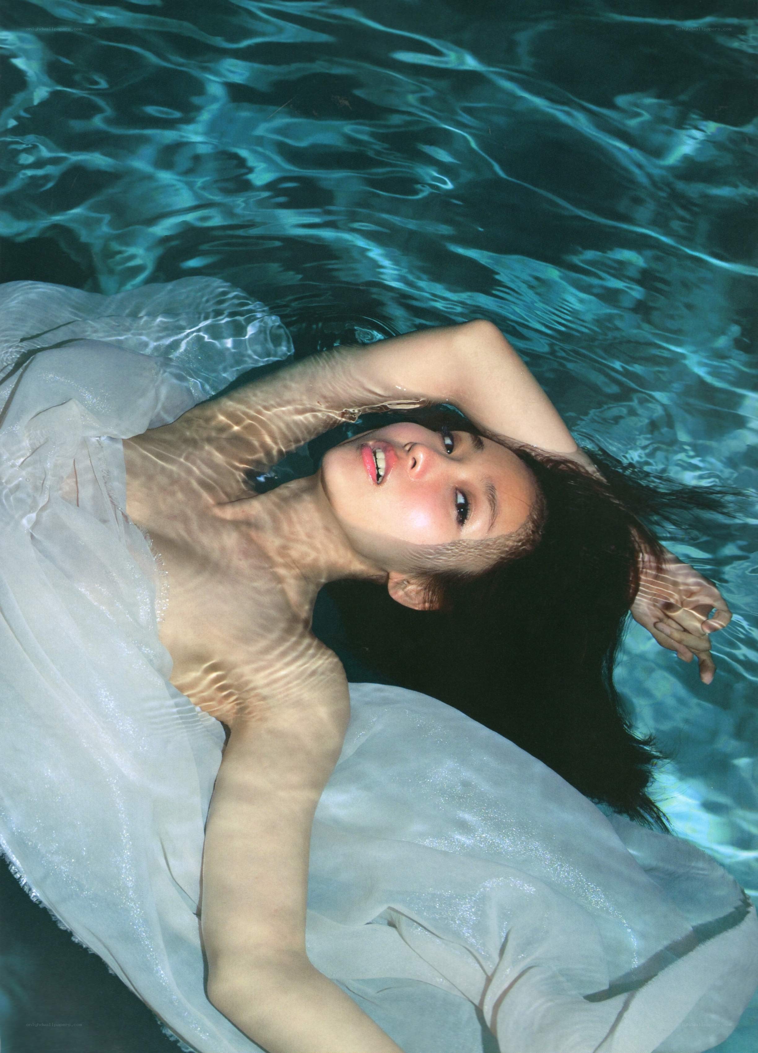 woman floating in pool