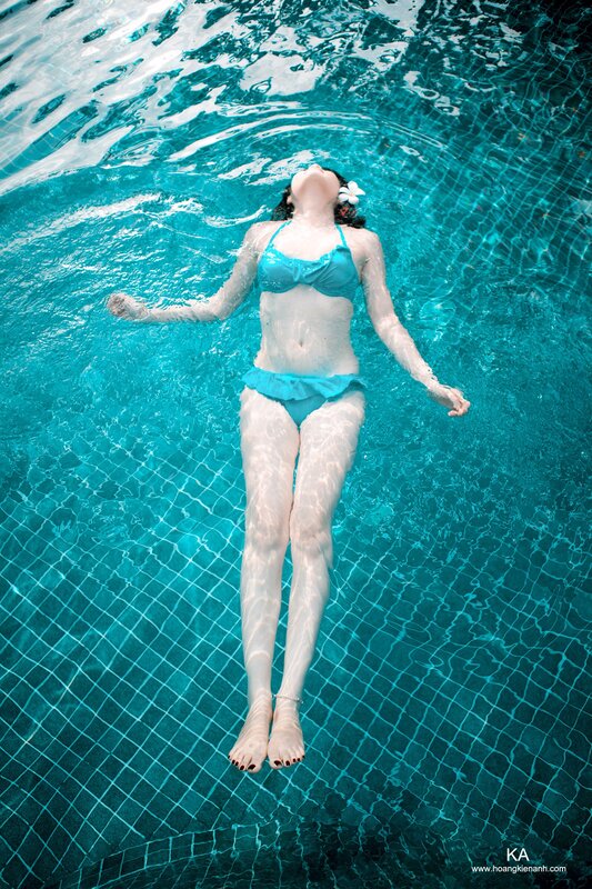 woman floating in pool