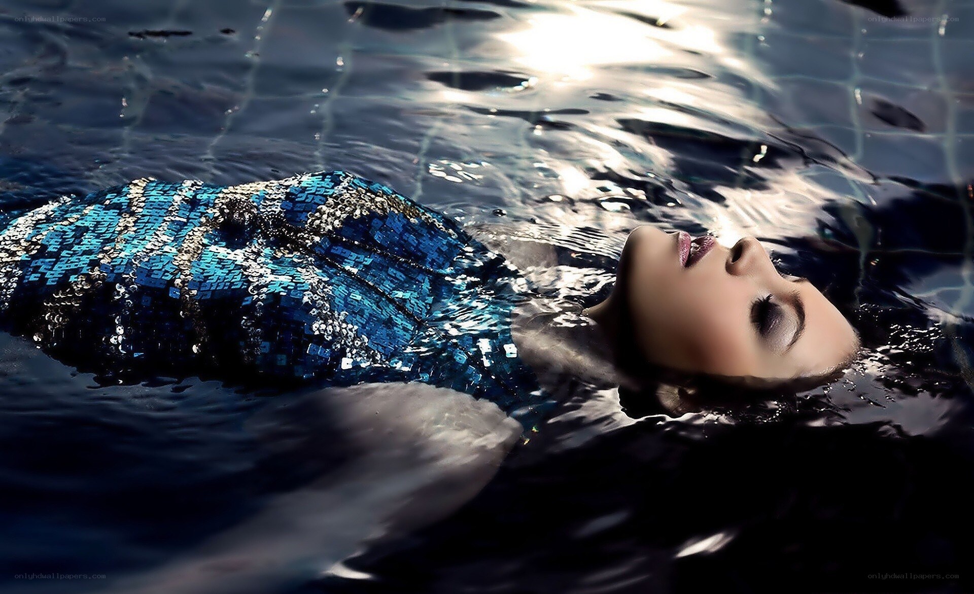 woman floating in pool