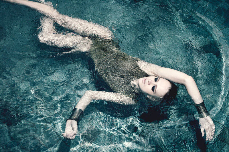 Woman Floating in Pool — Blue, Serene, Photograph