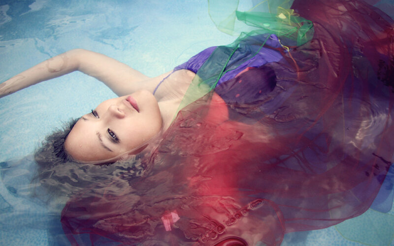 Woman Floating in Pool — Blue, Serene