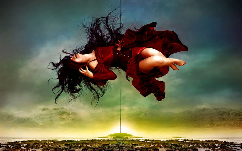 woman floating in red dress