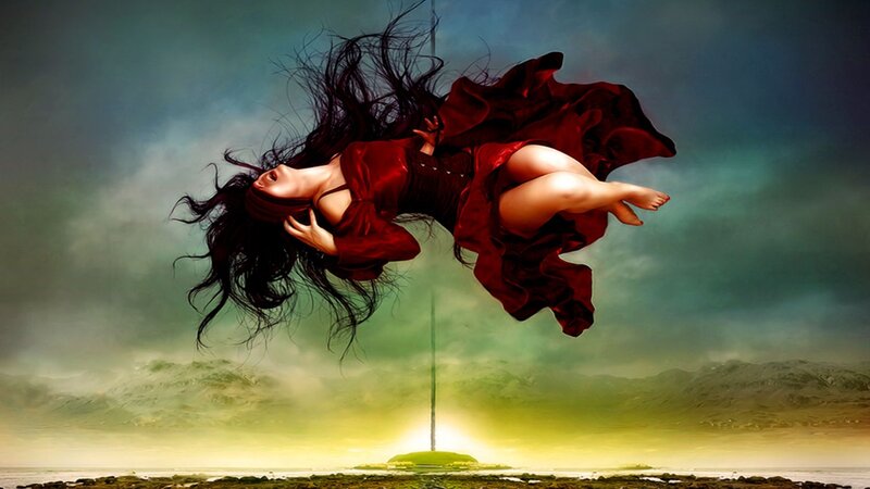 woman floating in red dress